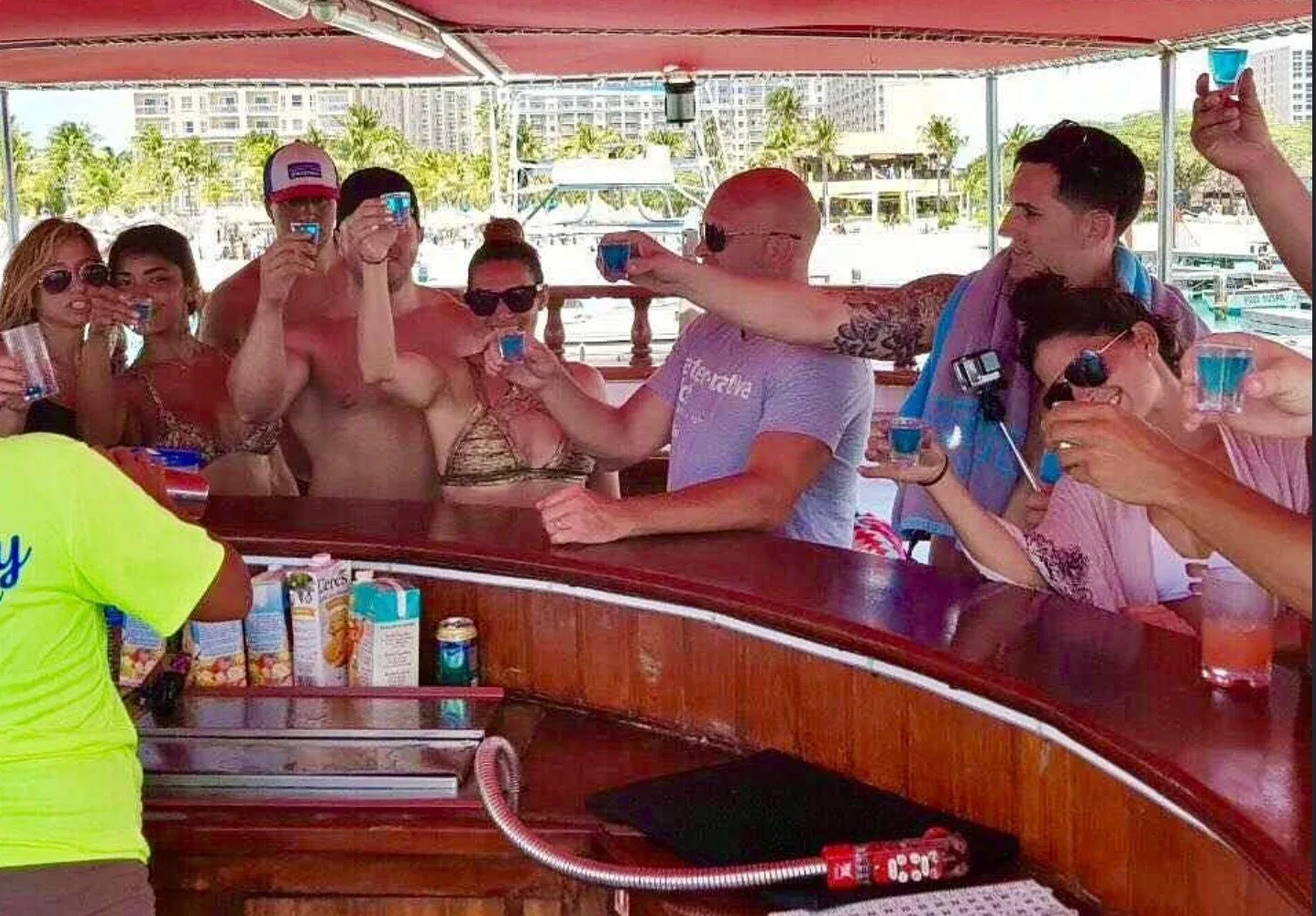 Guests toasting with drinks at the onboard bar